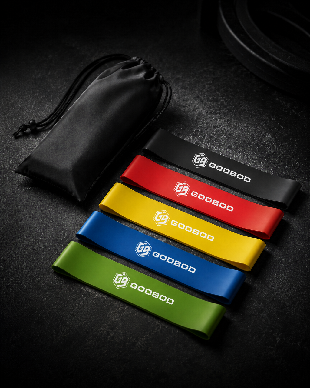 GODBOD short loop resistance bands and carry pouch on a dark training surface